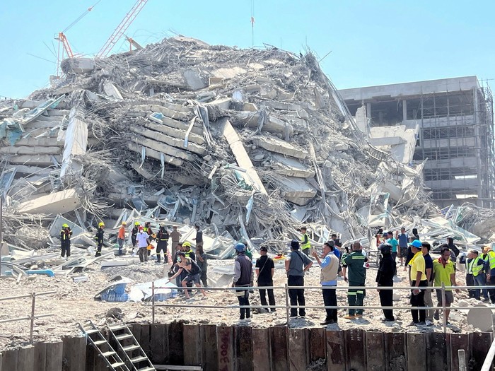 Rescuers work at the site of a collapsed building after the tremors of a strong earthquake that struck central Myanmar on Friday affected Bangkok, Thailand, March 28, 2025. REUTERS/Ann Wang