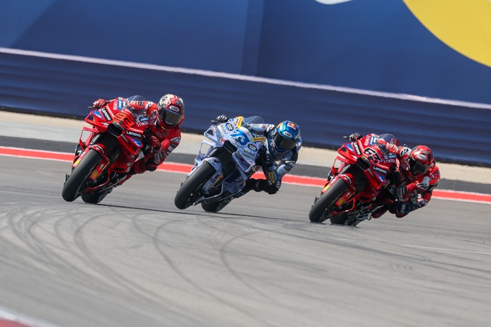 AUSTIN, TX - MARCH 29:  Marc Marquez (93) of Spain and Ducati Lenovo Team leads Alex Marquez (73) of Spain and BK8 Gresini Racing MotoGP and Francesco Bagnaia (63) of Italy and Ducati Lenovo Team out of turn 20 on the opening lap of the Tissot Sprint Race at the MotoGP Red Bull Grand Prix of the Americas on March 29, 2025, at Circuit of The Americas in Austin, Texas. (Photo by David Buono/Icon Sportswire via Getty Images)