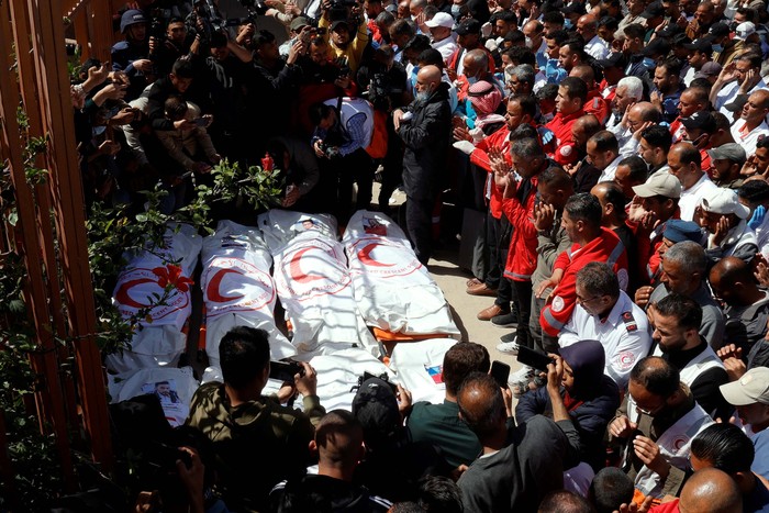 Palestinians mourn medics, who came under Israeli fire while on a rescue mission, after their bodies were recovered, according to the Red Cross, at Nasser hospital in Khan Younis in the southern Gaza Strip March 31, 2025. REUTERS/Hatem Khaled     TPX IMAGES OF THE DAY