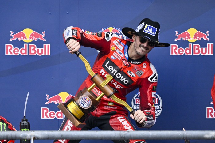 Mar 30, 2025; Austin, TX, USA; Francesco Bagnaia (63) of Italy and Ducati Lenovo Team holds up the first place trophy after he wins the 2025 Grand Prix of the Americas at Circuit of The Americas. Mandatory Credit: Jerome Miron-Imagn Images