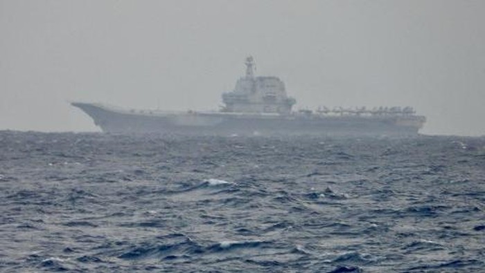 This handout photo taken on March 31, 2025 and released by the Taiwan Defence Ministry on April 1, 2025 shows the Chinese aircraft carrier Shandong sailing in waters off Taiwan. China on April 1 sent its army, navy, air and rocket forces to surround Taiwan for drills Beijing said were aimed at practising a blockade of the self-ruled island. (Photo by Handout / TAIWAN DEFENCE MINISTRY / AFP) / RESTRICTED TO EDITORIAL USE - MANDATORY CREDIT 