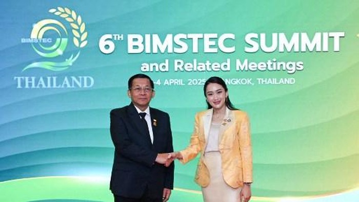 This handout picture taken and released by Thailands Ministry of Foreign Affairs on April 4, 2025 shows Thailands Prime Minister Paetongtarn Shinawatra (R) shaking hands with Myanmars military chief Min Aung Hlaing (L) at the 6th Bengal Initiative for Multi-Sectoral Technical and Economic Cooperation (BIMSTEC) summit in Bangkok. (Photo by HANDOUT / THAILANDS MINISTRY OF FOREIGN AFFAIRS / AFP) / RESTRICTED TO EDITORIAL USE - MANDATORY CREDIT 