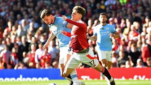 Soccer Football - Premier League - Manchester United v Manchester City - Old Trafford, Manchester, Britain - April 6, 2025  Manchester Citys Ruben Dias fouls Manchester Uniteds Alejandro Garnacho REUTERS/Peter Powell EDITORIAL USE ONLY. NO USE WITH UNAUTHORIZED AUDIO, VIDEO, DATA, FIXTURE LISTS, CLUB/LEAGUE LOGOS OR LIVE SERVICES. ONLINE IN-MATCH USE LIMITED TO 120 IMAGES, NO VIDEO EMULATION. NO USE IN BETTING, GAMES OR SINGLE CLUB/LEAGUE/PLAYER PUBLICATIONS. PLEASE CONTACT YOUR ACCOUNT REPRESENTATIVE FOR FURTHER DETAILS..