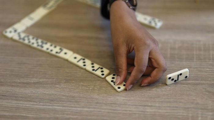 Festival at la Maison Bakhita, Paris, France. Game of dominoes. (Photo by: Godong/Universal Images Group via Getty Images)