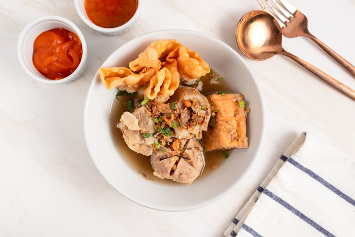 Bakso Arema, Meatballs Food Special from Malang East Java Indonesia. Close Up. Served with Soy Sauce, Sauce, and Chilli Paste
