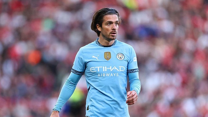 MANCHESTER, ENGLAND - APRIL 6: Jack Grealish of Manchester City during the Premier League match between Manchester United FC and Manchester City FC at Old Trafford on April 6, 2025 in Manchester, England. (Photo by Robbie Jay Barratt - AMA/Getty Images)