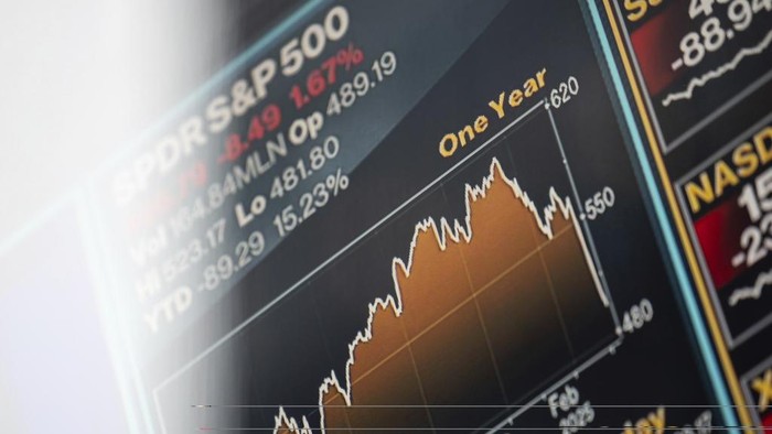 A screen shows stock prices at the Nasdaq MarketSite, Monday, April 7, 2025, in New York. (AP Photo/Yuki Iwamura)