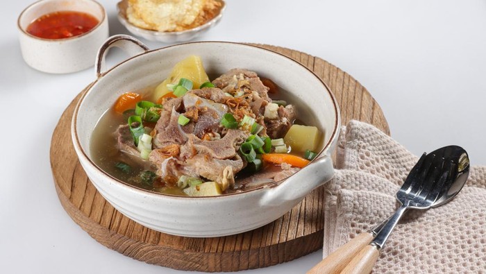 Sop Buntut or Sup Buntut is Indonesian Oxtail Soup with Carrot, Potato and Spring Onions.