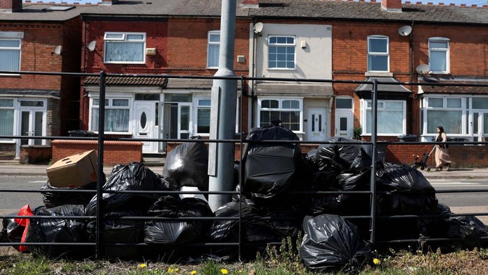 Rubbish bags lie on the street, as the strike action by Birmingham bin workers represented by the Unite union enters its fifth week in Birmingham, Britain, April 11, 2025. REUTERS/Hannah McKay