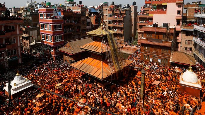 Devotees play traditional musical instruments as they celebrate 