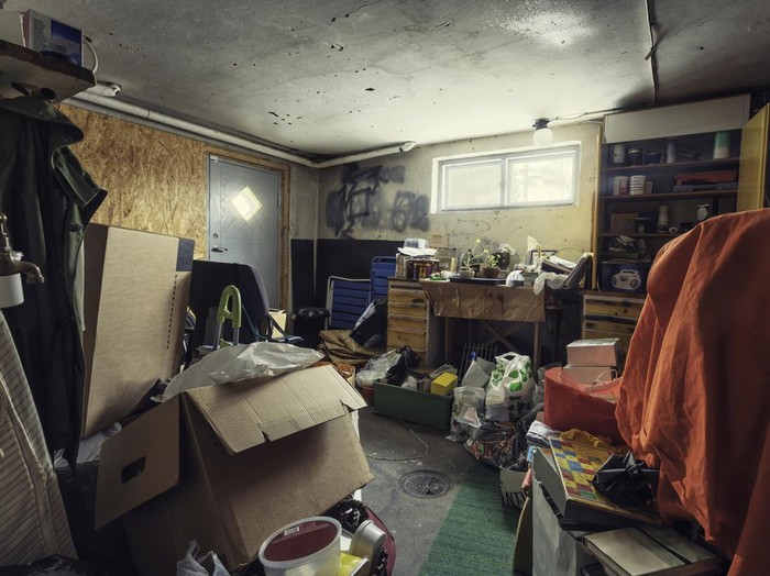 A messy basement / storage room with lots of things.