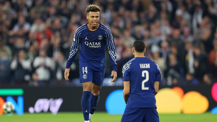 BIRMINGHAM, ENGLAND - APRIL 15: Desire Doue of celebrates with Achraf Hakimi of Paris Saint Germain after the UEFA Champions League 2024/25 Quarter Final Second Leg match between Aston Villa FC and Paris Saint-Germain at Villa Park on April 15, 2025 in Birmingham, England. (Photo by Molly Darlington/Copa/Getty Images)