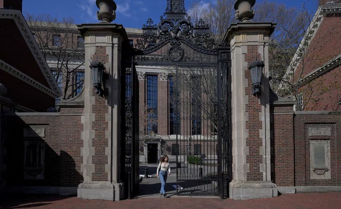 A woman walks on the campus of Harvard University in Cambridge, Massachusetts, U.S., April 15, 2025. REUTERS/Faith Ninivaggi Purchase Licensing Rights