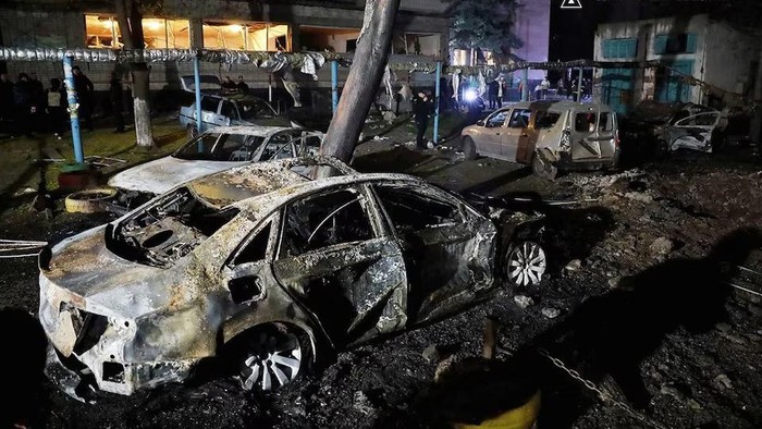 Burned cars are seen next to an apartment building damaged during a Russian drone strike, amid Russias attack on Ukraine, in Dnipro, Ukraine, in this handout picture released April 17, 2025. Press service of the State Emergency Service of Ukraine/Handout via REUTERS Purchase Licensing Rights