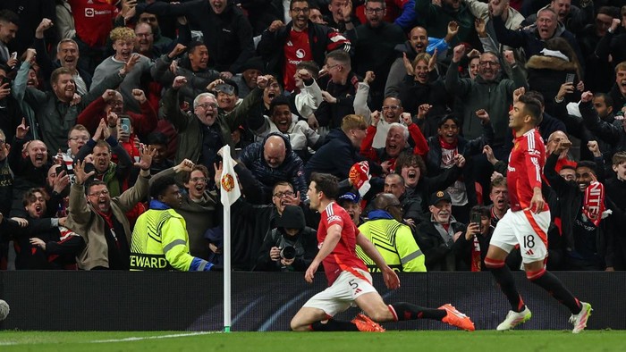 MANCHESTER, ENGLAND - APRIL 17: Manchester Uniteds Harry Maguire celebrates scoring his sides fifth goal with Casemiro close by during the UEFA Europa League 2024/25 Quarter Final Second Leg match between Manchester United and Olympique Lyonnais at Old Trafford on April 17, 2025 in Manchester, England. (Photo by Alex Dodd - CameraSport via Getty Images)