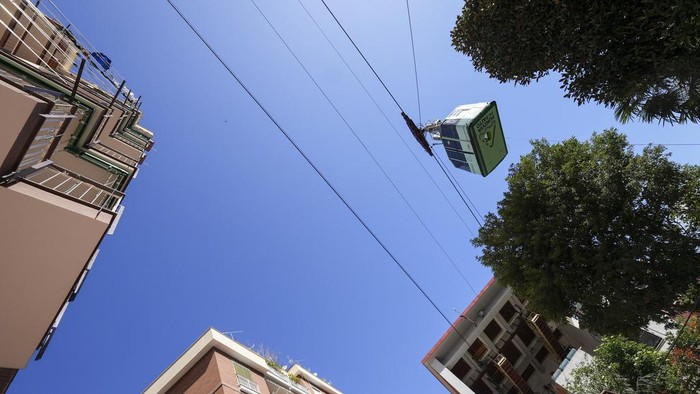 View of the Monte Faito cable car departure station in Castellammare di Stabia near Naples, southern Italy, Friday, April 18, 2025, with the cabin from which nine passengers were rescued when the traction cable broke Thursday, killing four people in another cabin that fell further up the mountain. (AP Photo/Salvatore Laporta)