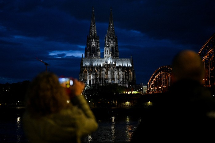 The Cologne Cathedral, a UNESCO World Heritage Site, is illuminated with the new LED lights, in Cologne, Germany, April 20, 2025. REUTERS/Jana Rodenbusch