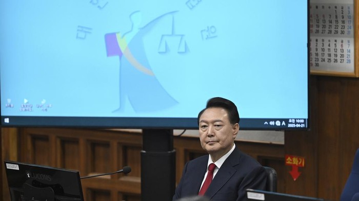 South Korea's ousted President Yoon Suk Yeol, who is facing charges of orchestrating a rebellion when he declared martial law on Dec. 3, attends his criminal trial at a courtroom of the Seoul Central District Court in Seoul Monday, April 21, 2025. (Jung Yeon-je/Pool Photo via AP)