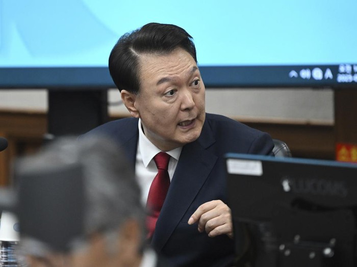 South Koreas ousted President Yoon Suk Yeol, who is facing charges of orchestrating a rebellion when he declared martial law on Dec. 3, attends his criminal trial at a courtroom of the Seoul Central District Court in Seoul Monday, April 21, 2025. (Jung Yeon-je/Pool Photo via AP)
