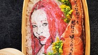 Chanmina, penyanyi Korea Selatan-Jepang, hadir dalam bento dengan warna rambut yang nyentrik. Sosoknya dilukiskan berambut merah muda dan ditemani potongan salmon di sisinya. Foto: Instagram/nancychannel