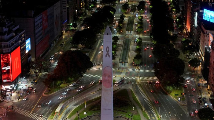A drone view shows the projection of Pope Francis' portrait on the Obelisk, following the death of the pontiff, in Buenos Aires, Argentina, April 21, 2025. REUTERS/Martin Cossarini