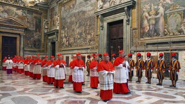 FILE - In this photo from files taken on April 18, 2005 and released by the Vatican paper L'Osservatore Romano, Cardinals walk in procession to the Sistine Chapel at the Vatican, at the beginning of the conclave. (Osservatore Romano via AP, File)