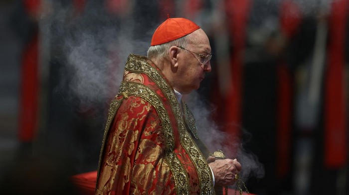 Cardinal Camerlengo Kevin Joseph Farrell walks, on the day of the translation of Pope Francis body, in St. Peters Basilica at the Vatican, April 23, 2025. REUTERS/Yara Nardi     TPX IMAGES OF THE DAY