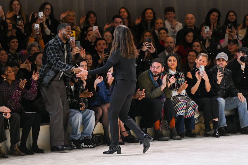 Kendrick Lamar PARIS, FRANCE - JANUARY 23: (EDITORIAL USE ONLY - For Non-Editorial use please seek approval from Fashion House) Designer Virginie Viard acknowledges the applause of Naomi Campbell and Kendrick Lamar after the Chanel Haute Couture Spring/Summer 2024 show as part of Paris Fashion Week on January 23, 2024 in Paris, France. (Photo by Stephane Cardinale - Corbis/Corbis via Getty Images)