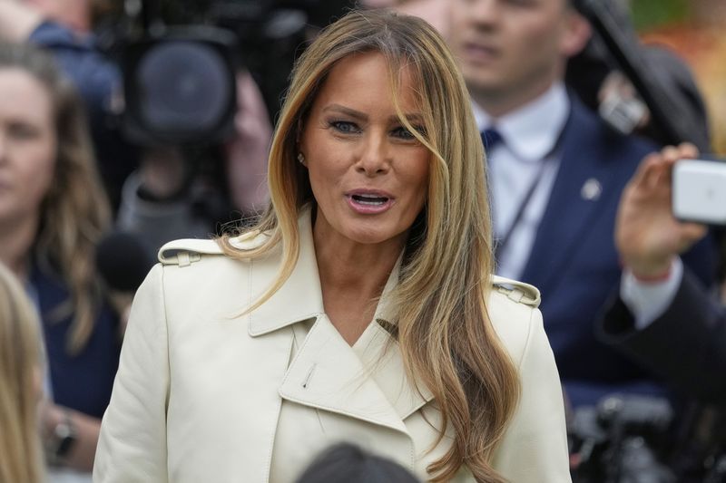 President Donald Trump and first lady Melania Trump arrive for the White House Easter Egg Roll on the South Lawn of the White House, Monday, April 21, 2025, in Washington. (AP Photo/Alex Brandon)