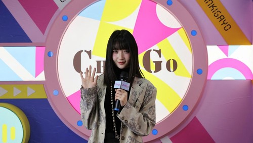 Visitors prepare to take photos in costumes at Chen Go, an 