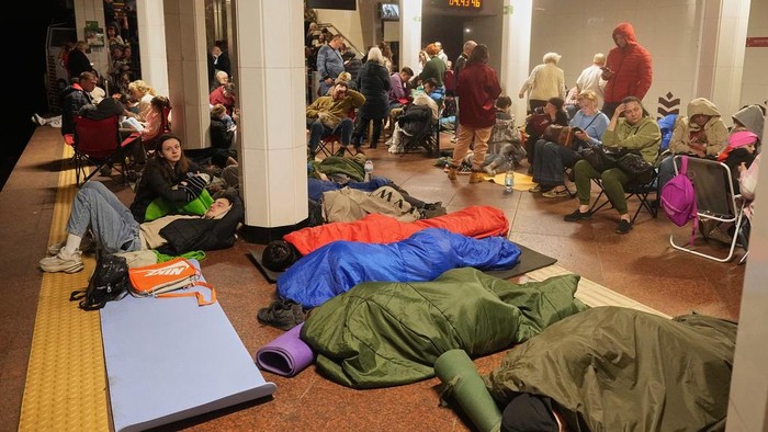 People rest in a metro station, being used as a bomb shelter, during a Russian missile attack in Kyiv, Ukraine, early Thursday, April 24, 2025. (AP Photo/Efrem Lukatsky)