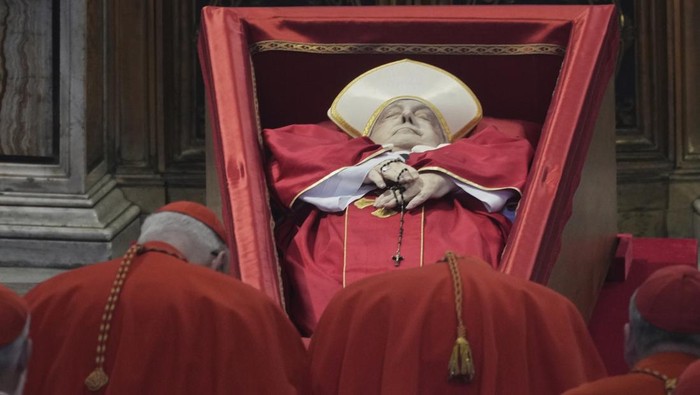 Cardinals pay their respects to Pope Francis inside St. Peters Basilica at the Vatican, Wednesday, April 23, 2025, where his body will lie in state for three days. (AP Photo/Andrew Medichini, Pool)