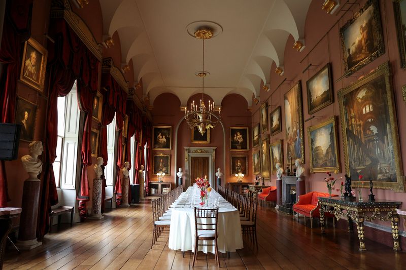 Catering staff set the table in the renovated Long Gallery at Castle Howard, renowned for its appearances in Brideshead Revisited and Bridgerton, during its unveiling following a major restoration, in York, Britain April 24, 2025. REUTERS/Temilade Adelaja