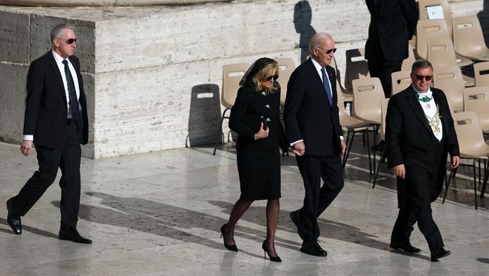 Former U.S. President Joe Biden and his wife Jill Biden walk ahead of the funeral Mass of Pope Francis, in Saint Peters Square, at the Vatican, on Saturday. Kai Pfaffenbach/Reuters