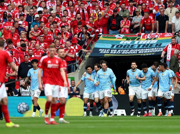 LONDON, ENGLAND - APRIL 27: Rico Lewis of Manchester City celebrates scoring his team's first goal with teammates during the Emirates FA Cup Semi Final match between Nottingham Forest and Manchester City at Wembley Stadium on April 27, 2025 in London, England. (Photo by Cameron Smith - The FA/The FA via Getty Images)