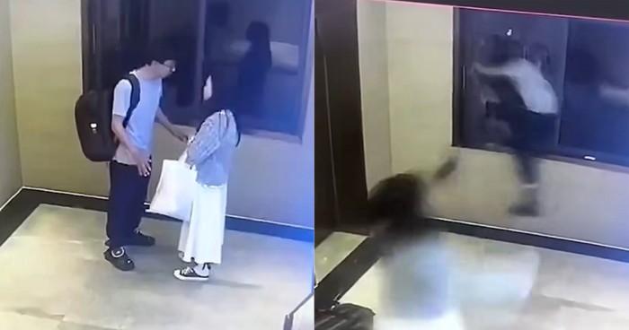 Pria melompat menabrak jendela kaca hotel