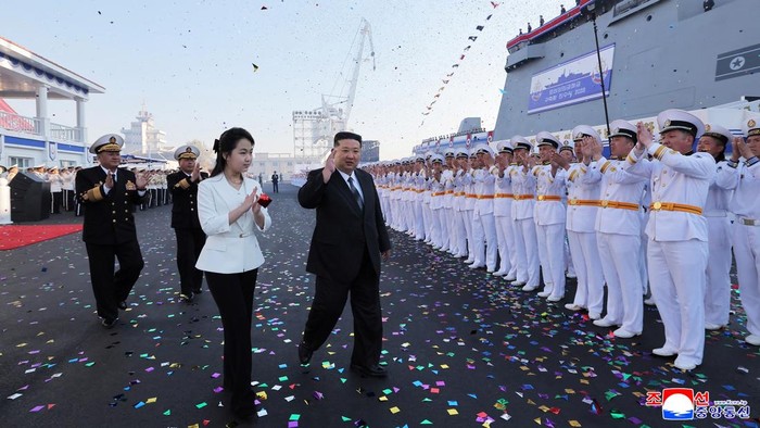 North Korean leader Kim Jong Un, accompanied by his daughter Kim Ju Ae, attends a ceremony for the launch of a 