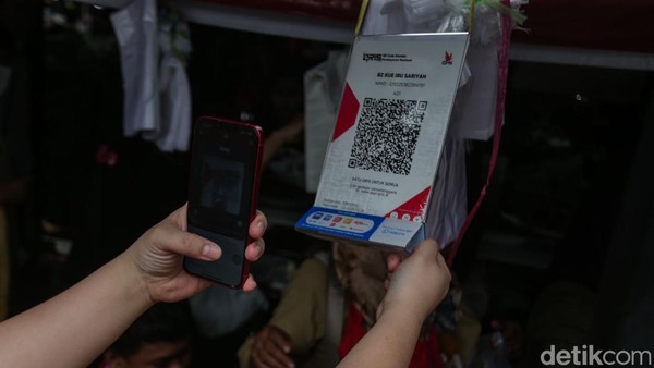 Quick Response Indonesian Standard (QRIS) sempat menjadi sorotan pemerintah Amerika Serikat (AS). Transaksi digital tersebut dinilai membatasi ruang gerak perusahaan asing.