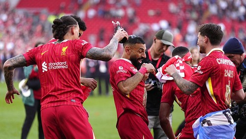 Liverpools Mohamed Salah (centre) and team-mates celebrate victory and the Premier League title following the Premier League match at Anfield, Liverpool. Picture date: Sunday April 27, 2025. (Photo by Peter Byrne/PA Images via Getty Images)