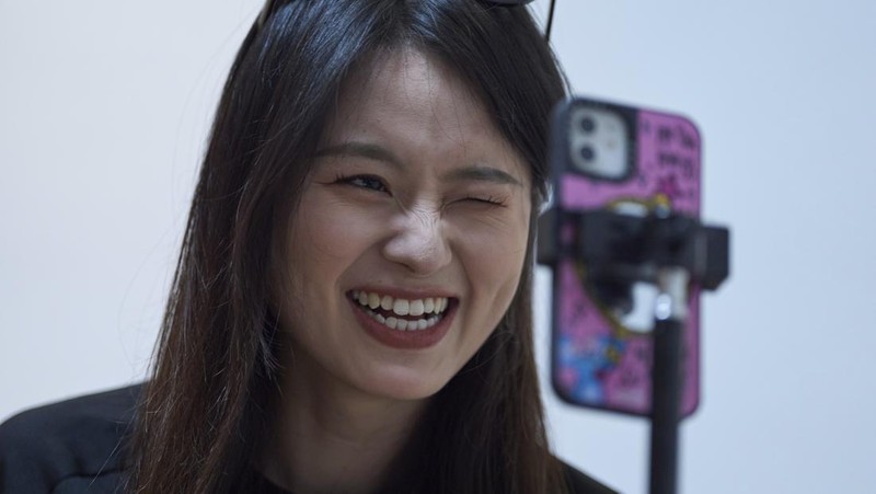 Tian Xin, a cyber matchmaker, hosts a livestream using the Chinese social media app Xiaohongshu (RedNote) from Hangzhou, China, early Friday, April 25, 2025. (AP Photo/Ng Han Guan)