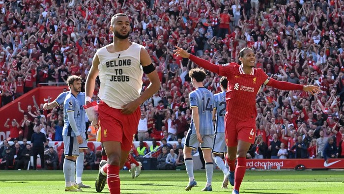 LIVERPOOL, ENGLAND - APRIL 27: (SUN OUT, SUN ON SUNDAY OUT) Cody Gakpo of Liverpool celebrates scoring his teams third goal, by revealing a under shirt which reads I belong to Jesus during the Premier League match between Liverpool FC and Tottenham Hotspur FC at Anfield on April 27, 2025 in Liverpool, England. (Photo by Liverpool FC/Liverpool FC via Getty Images)