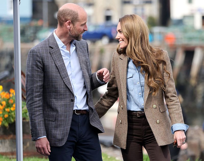 TOBERMORY, SCOTLAND - APRIL 29: Prince William, Prince of Wales, known as the Duke of Rothesay and Catherine, Princess of Wales, known as the Duchess of Rothesay when in Scotland, smile during a tour of an artisan market on April 29, 2025 in Tobermory, Scotland. The Prince and Princess of Wales are on a two-day visit to the Isles of Mull and Iona on the 29th and 30th of April to engage with rural island communities. During their time on the islands, they will connect with local residents, highlighting the value of social bonds and underscoring the importance of safeguarding and advocating for the natural environment. (Photo by Chris Jackson/Getty Images)