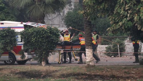 Rescuers wheel a body towards an ambulance after it was recovered from a building hit by an Indian strike in Muridke near Lahore, Pakistan, May 7, 2025. REUTERS/Mohsin Raza Purchase Licensing Rights