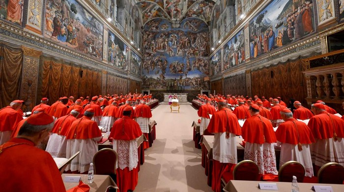 Pope Leo XIV stands in the Sistine Chapel among cardinals after being elected, at the Vatican, May 8, 2025. Vatican Media/­Francesco Sforza/Handout via REUTERS    ATTENTION EDITORS - THIS IMAGE WAS PROVIDED BY A THIRD PARTY.