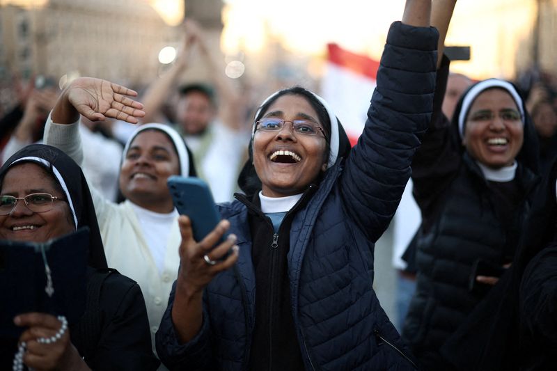 Nuns react to the announcement that U.S. Cardinal Robert Prevost has been elected by the conclave as new pope, with the name Pope Leo XIV, at the Vatican, May 8, 2025. REUTERS/Marko Djurica      TPX IMAGES OF THE DAY