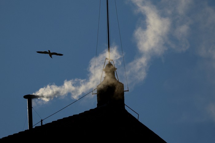 White smoke rises from the chimney on the Sistine Chapel, indicating that a new pope has been elected at the Vatican, May 8, 2025.   REUTERS/Yara Nardi