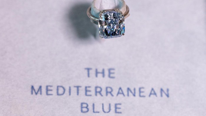 A Sotheby’s staff holds 
