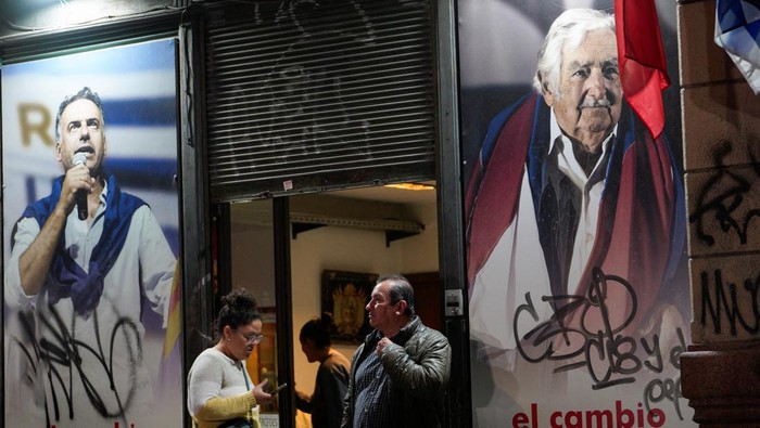 People gather outside the Movimiento de Participacion Popular (MPP) party headquarters, following the death of Uruguay's former President Jose 