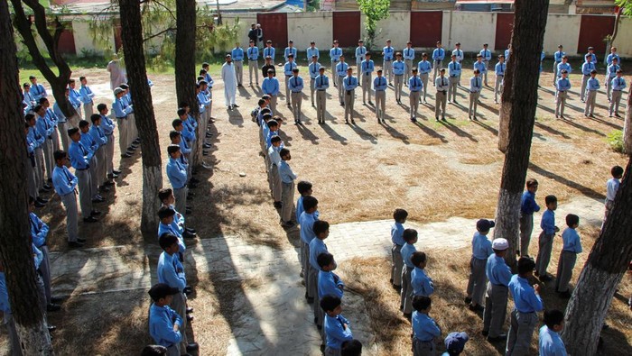 Students attend morning assembly as schools reopen following the ceasefire announcement between India and Pakistan, in Muzaffarabad, Pakistani Kashmir, May 13, 2025. REUTERS/Naseer ud Din