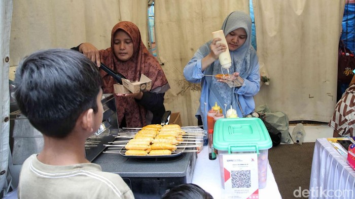 UMKM di Tanjung Priok gunakan QRIS untuk transaksi non-tunai. Solusi praktis, aman, dan modern menuju ekonomi digital inklusif.